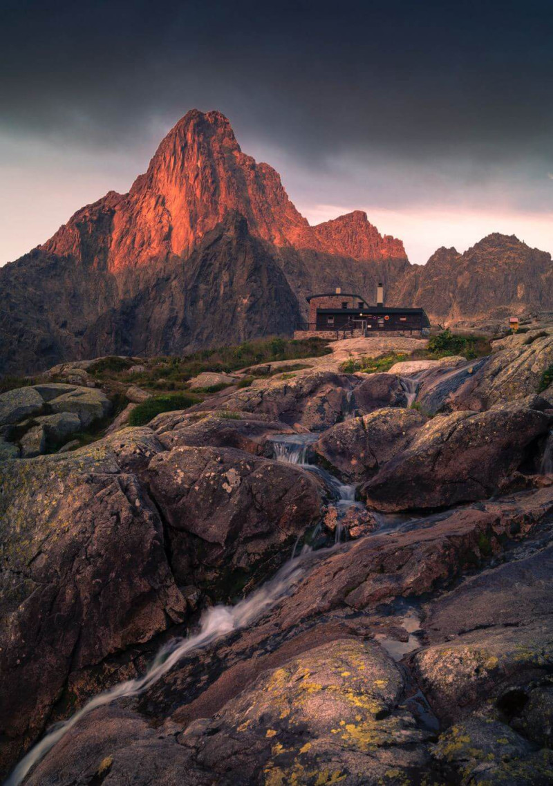 A creek and mountain in the dusk